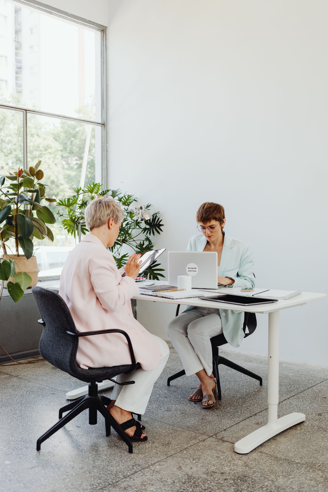 Two colleagues going through an account together