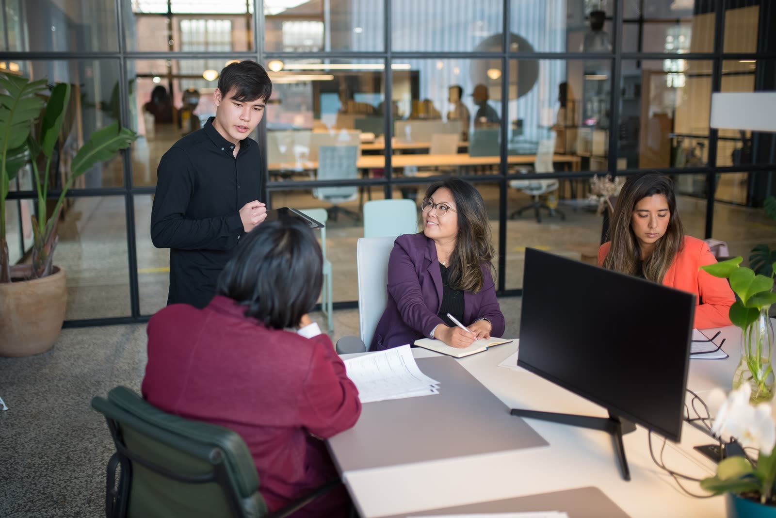 A team reviewing plans together in an office